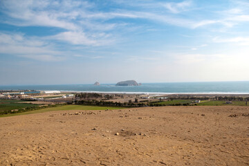 PACHACAMAC, LIMA PERU: Looking at the Pacific ocean and a islands front the Temple of the Sun in Pachacamac, Lima Peru