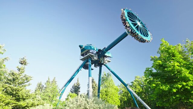 Amusement park ride big pendulum discovery thrilling ride. Cheerful entertainments in park of attractions
