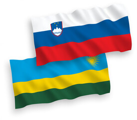 Obraz premium National vector fabric wave flags of Slovenia and Republic of Rwanda isolated on white background. 1 to 2 proportion.