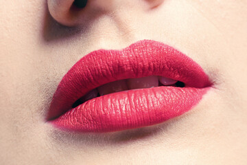Closeup of beautiful lips with red lipstick.