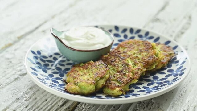 The Chef Serves Zucchini And Halloumi Fritters.
