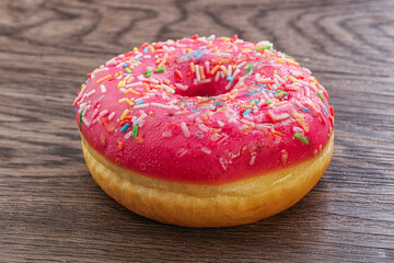 Sweet glazed struwberry donut with icing