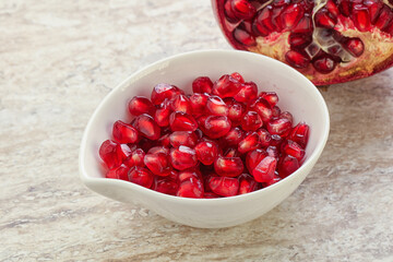 Ripe red Pomegranate seeds in the bowl