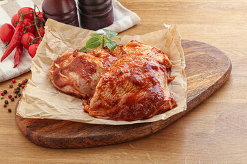 Marinated chicken leg in tomato sauce