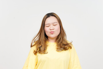 Blowing Kiss of Beautiful Asian Woman wearing yellow T-Shirt Isolated On White Background