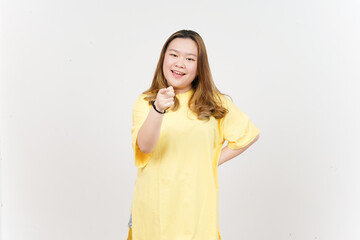 Smiling and pointing at you of Beautiful Asian Woman wearing yellow T-Shirt Isolated On White