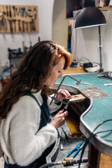 Fototapeta na wymiar Woman Making Handmade Jewelry