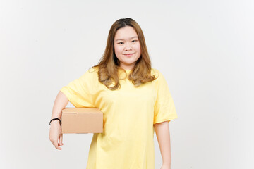 Obraz premium Holding Package Box or Cardboard Box of Beautiful Asian Woman wearing yellow T-Shirt