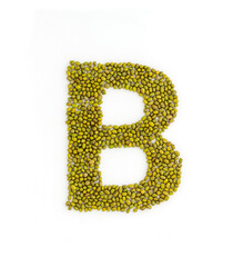 Capital letter B made from mung beans. Green mung bean font. Alphabet made from green gram . White...