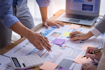 Financial, Brainstorming, Team of Businesswoman and Accountant checking Marketing Analysis data document Economist pointing to investment to compete with other companies. 