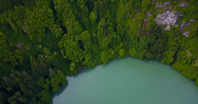DJI Drone video of Lagoa do Congro bird eye vertical 4k drone view. High quality video of a lake in Azores islands