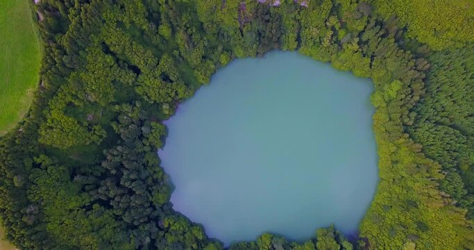 Topdown video in Sao Miguel (Azores). Lagoa do Congro bird eye vertical 4k drone view. High quality video of a lake in Azores islands
