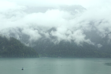 Mountain lake in the fog