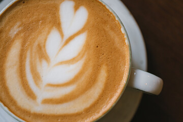 Cup of cappuccino with coconut milk. Macro shot. 