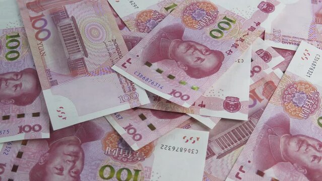 China yuan falling, couting - rotating background. Chinese trade. Business and Finance concepts.