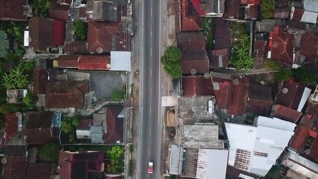 highway on the middle of population decent housing in central java