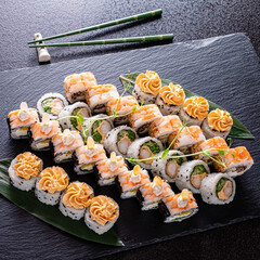 tasty sushi on the black background