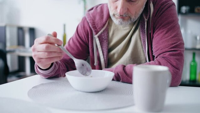 Senior man refusing to eat, unfulfilled life, depressed man, unhappy thoughts