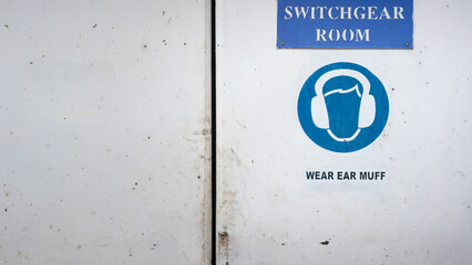 Caution sign to wear ear muff, the sound protective PPE which is showed on the door of engine...
