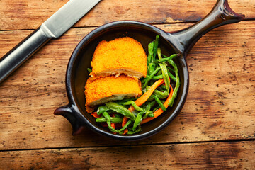 Roast chicken cutlets and vegetable garnish.