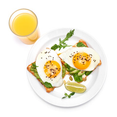 sliced avocado and fried egg on toasted bread isolated on white background
