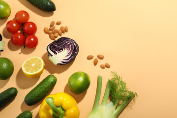 Different food on beige background, space for text