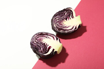 Halves of cabbage on two tone background