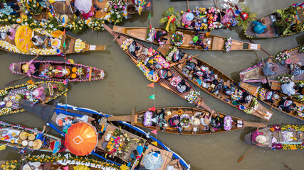 Aerial view floating festival in Thailand, People enjoy the candle procession in the river...