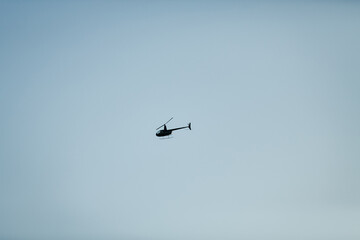 black helicopter in clear sky
