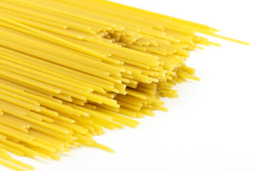 Raw spaghetti on white background, selective focus