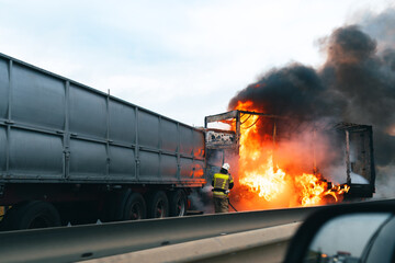 Car crash accident on a highway with damaged automobiles and smoke