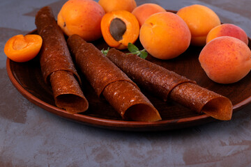 Fruit pastila with apricot and apple. Natural rolled dessert made of dried pureed fruits