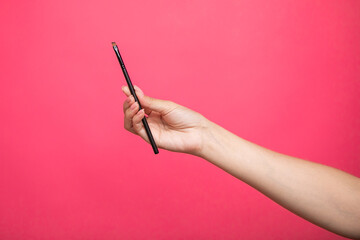 female hand with a brush for makeup