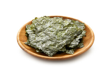 roasted nori laver seaweed snack in wood plate isolated on white background. nori laver seaweed crispy in wood plate isolated on white background. Gim, laver, nori, isolated © boommaval