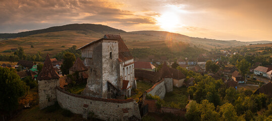 Aerial view with Roades fortified church from Transylvania, Romania, during a beautiful summer...