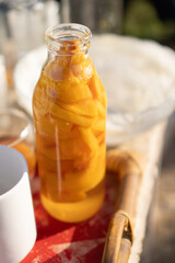 Bottle with fruits with evening light