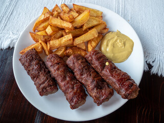 traditional romanian dish meatrolls or mici and french fies