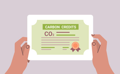 human hand CO2 limit emissions certificate net zero emission carbon credit offset concept