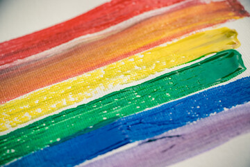 the colors of the rainbow and the lgtbi flag painted with gouache or watercolor on a sketchbook