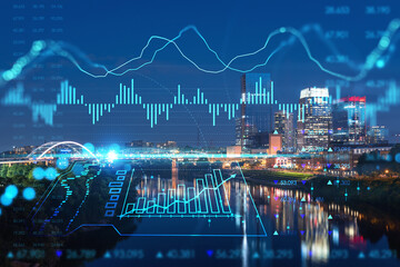 Panoramic view of Broadway district of Nashville over the river at illuminated night skyline, Tennessee, USA. Forex candlestick graph hologram. The concept of internet trading, brokerage and analysis