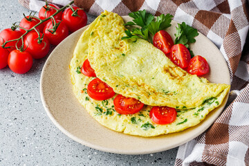 Omelet with dill filled tomatoes