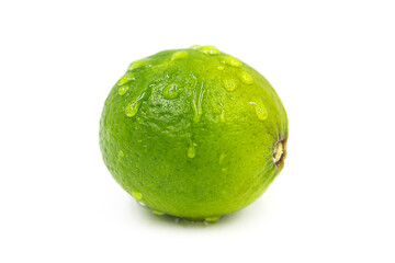 Whole ripe organic lime in water drops isolated on white background.
