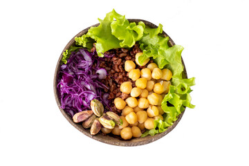 Vegan Buddha Bowl with vegetables, chickpeas, red rice, pistachios. Healthy and balanced food in a coconut bowl on an isolated white background.