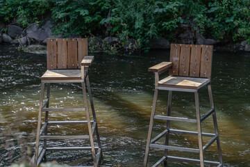 Two chairs in the river
