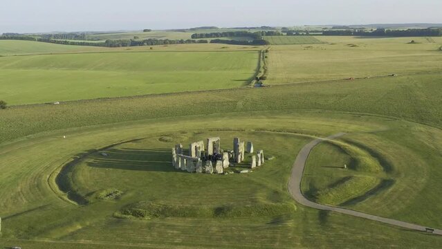 Stonehenge stone circle on a warm summery afternoon with shadows.