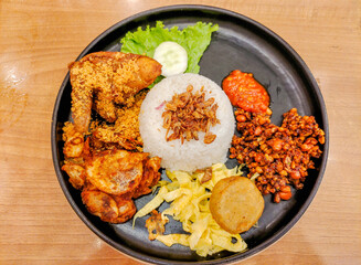 Nasi Uduk with chicken , fried onion, fried tempe , Potato Fritters 