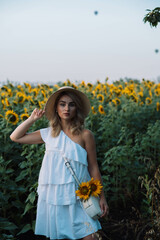 a series of photographs of a girl in a hat in sunflowers