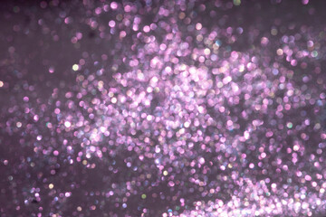 Violet background with glitter. Defocused purple glitter background for lettering and cards.