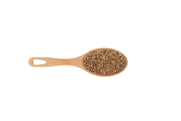 Hemp seeds or cannabis seeds in wooden spoon on white background, close-up. Organic food
