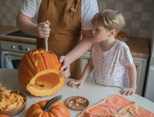 parent and child curving pumpkin